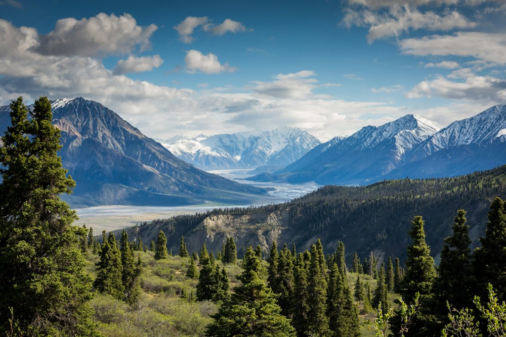 Sunlit mountain peaks beneath a blue sky